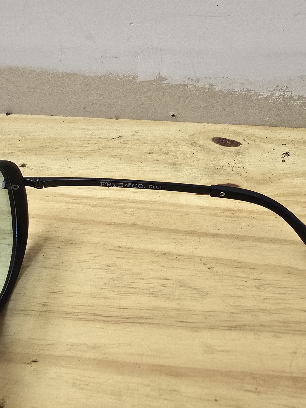 FRYE & Co. Black Round Sunglasses with Green Tint